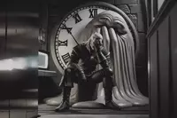 Геральд сидит на ступе с фейспалмом, а за его спиной растекаются часы